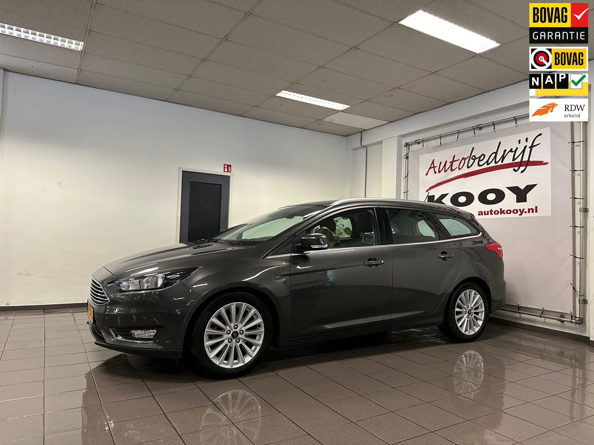 Ford Focus Wagon 1.0 Titanium * Navigatie / Cruise control / LM Velgen / NL Auto *